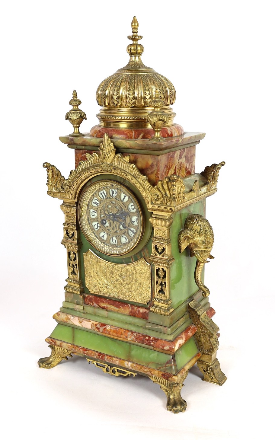 A late 19th century French ormolu mounted marble and green onyx clock garniture, of Indian inspiration, clock 34cm wide, 63cm high, side vases 36cm high